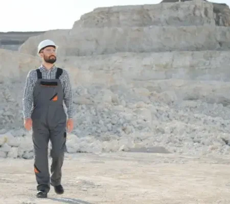 A miner walks at a rock quarry