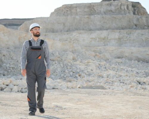 A miner walks at a rock quarry