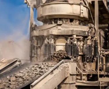 Cone crusher processing material with custom crusher parts for mining in active quarry operation