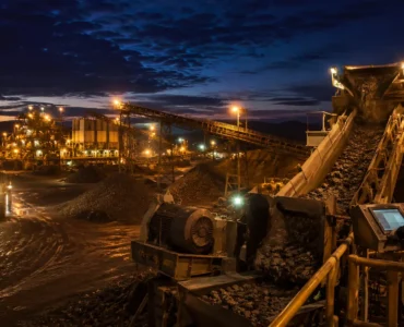 Mining crushing operation running at night illustrating the need for genuine 24/7 crusher support during continuous production shifts